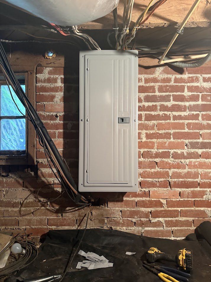 Finished new panel with cover installed on the brick wall