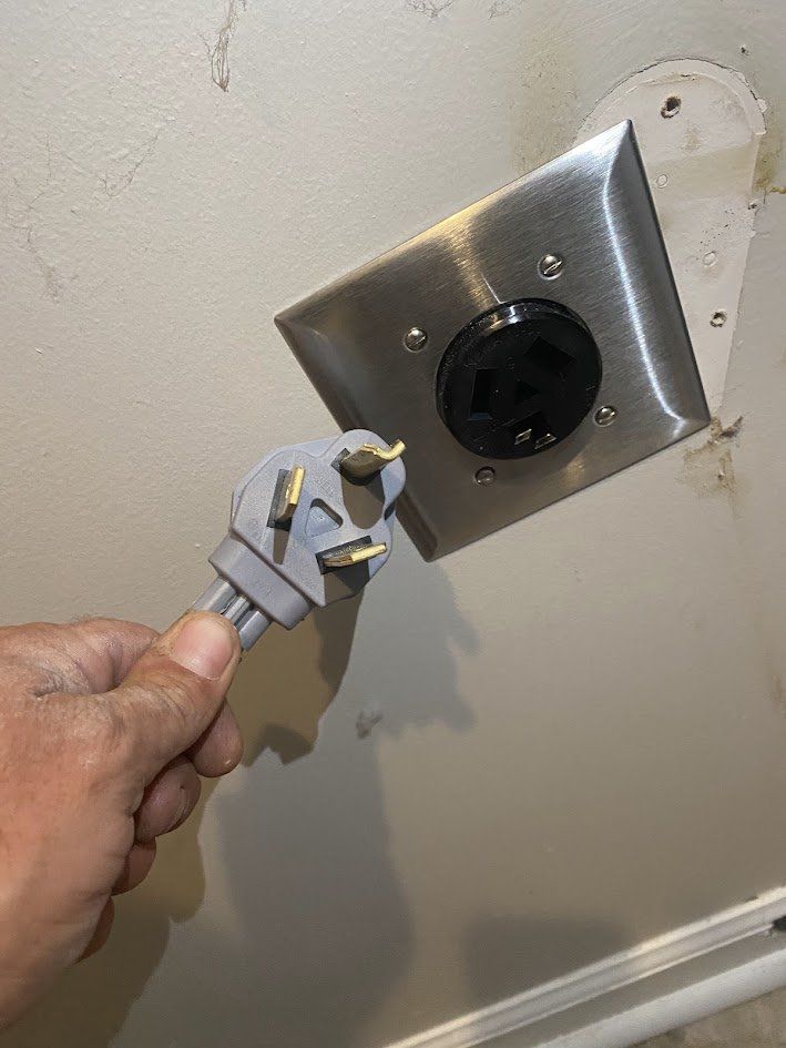 New dryer outlet with a stainless cover plate and a new dryer plug