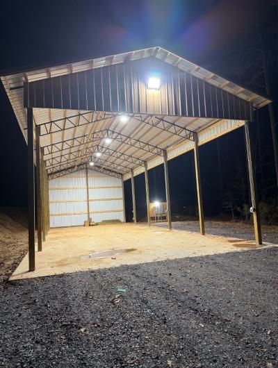 Pole barn lit up at night with new LED fixtures